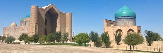 Turkistan Mausoleums: Explore the historic architecture and turquoise domes of Turkistan, Kazakhstan, under a clear blue sky.